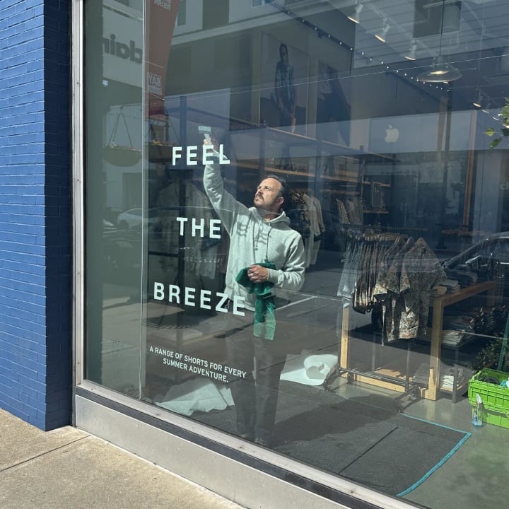 Window Vinyl Lettering Installation Feel The Breeze, custom signage project in the San Francisco Bay Area.