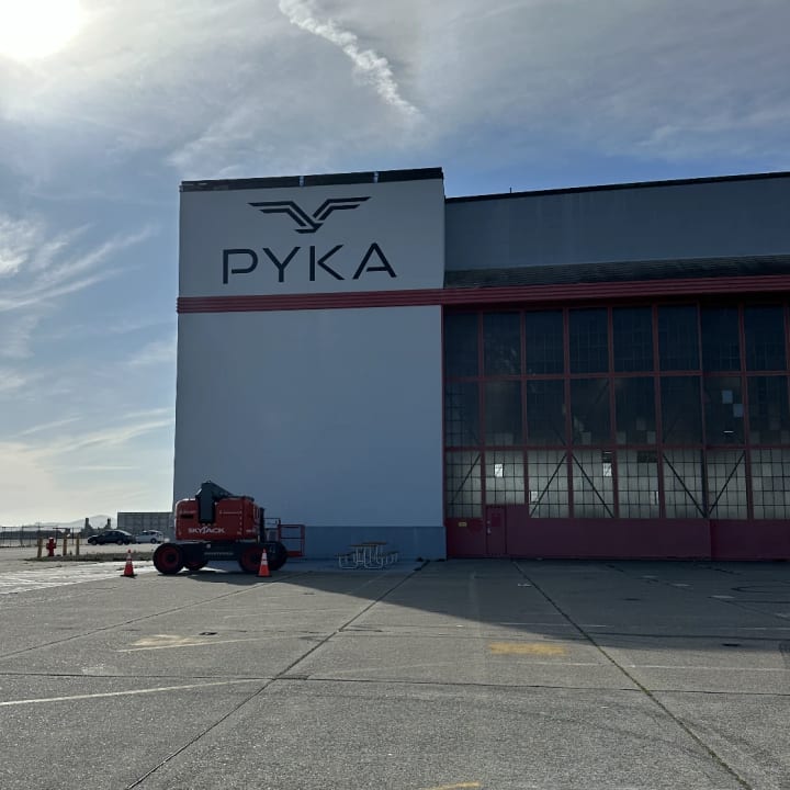 PYKA Hangar Exterior Building Signage Wide, custom signage project in the San Francisco Bay Area.