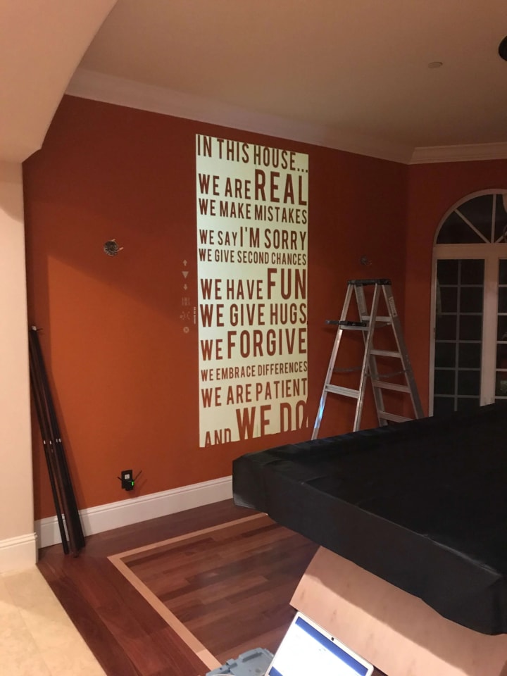 Innovative word cloud design projected inside a Martinez home, showcasing bespoke sign making craftsmanship in the Bay Area.