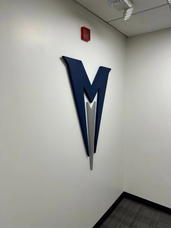 Custom painted 3D cut letters for an office logo, crafted with a CNC machine, displaying a unique font and color scheme for standout commercial signage.