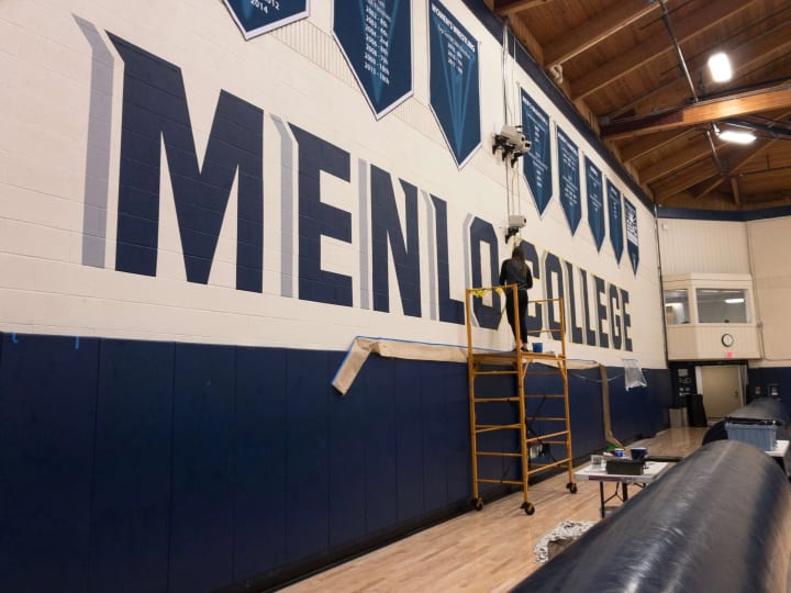 Menlo College's main gym facility gets a vibrant upgrade with 10-foot letters showcasing expert sign making skills
