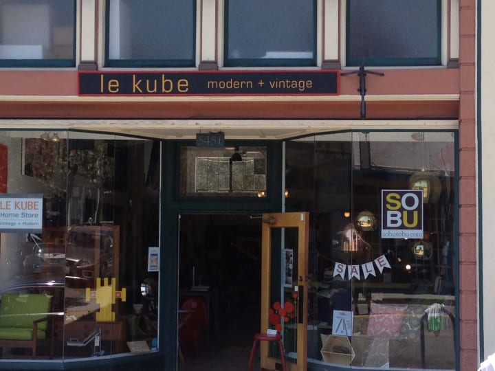 Charming wood 3D sign graces a Piedmont vintage shop, showcasing local craftsmanship in bespoke signage