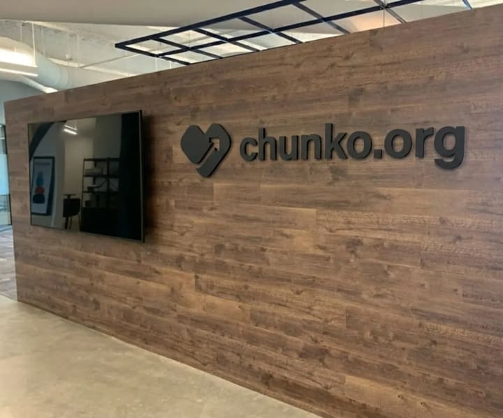 Reference image of a dimensional wordmark aligned on a business wall