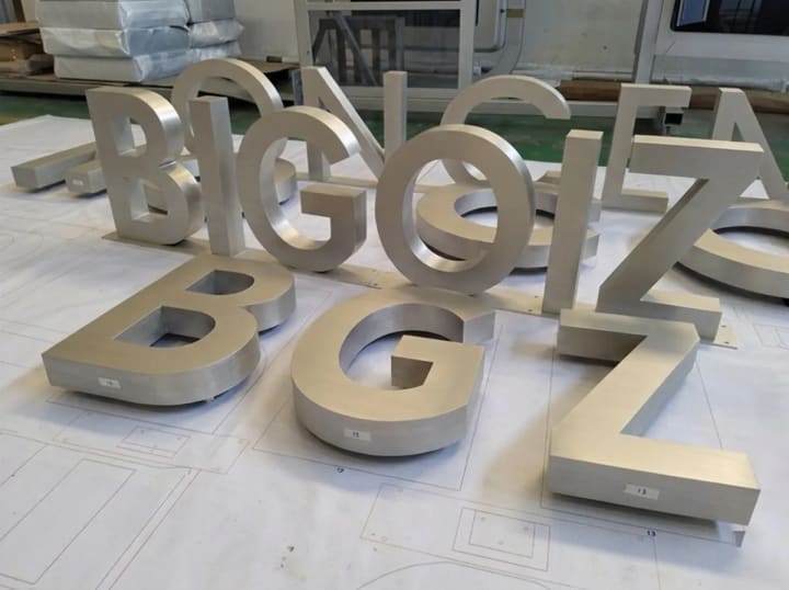 Reference image of individual logo letters mounted with consistent spacing