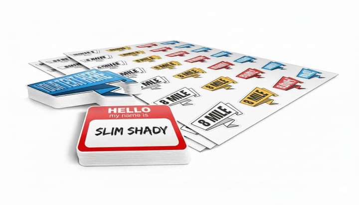 Concept display of many small stickers arranged on several white sheets