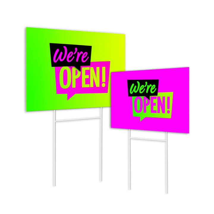 Concept image showing green and pink We’re Open yard signs
