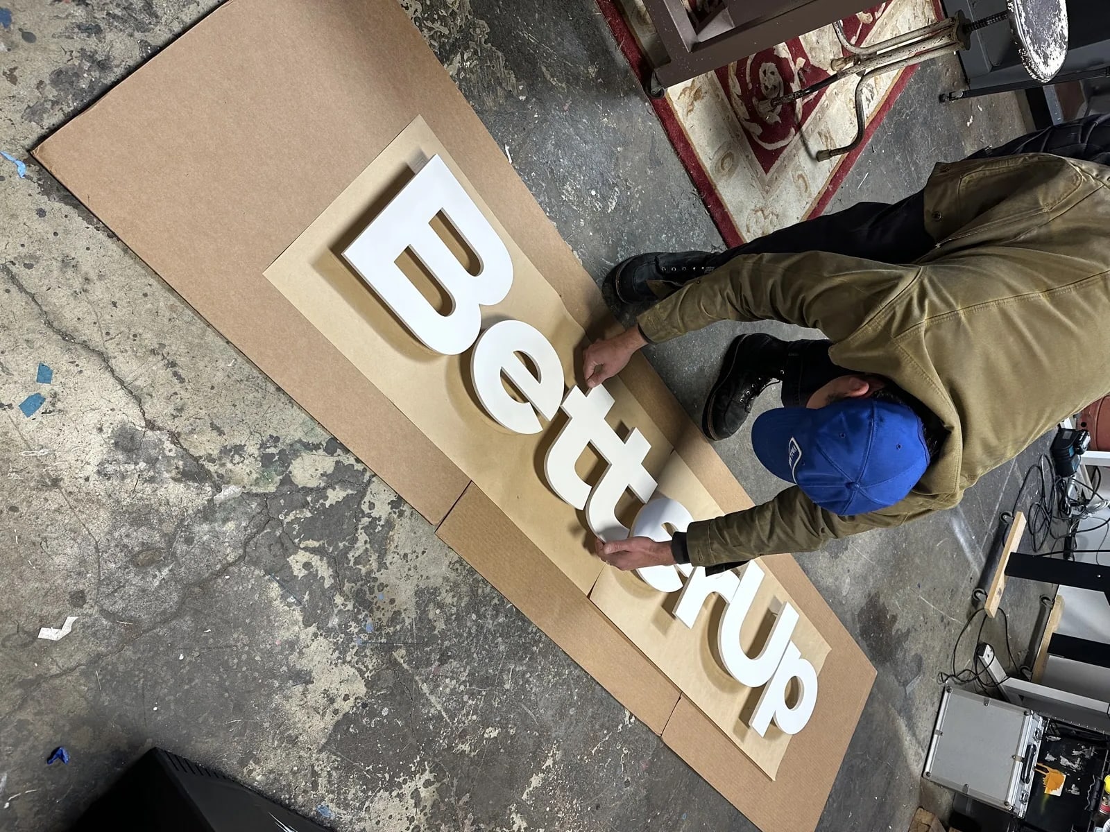 Flat finish dimensional letters in progress for BetterUp lobby signage
