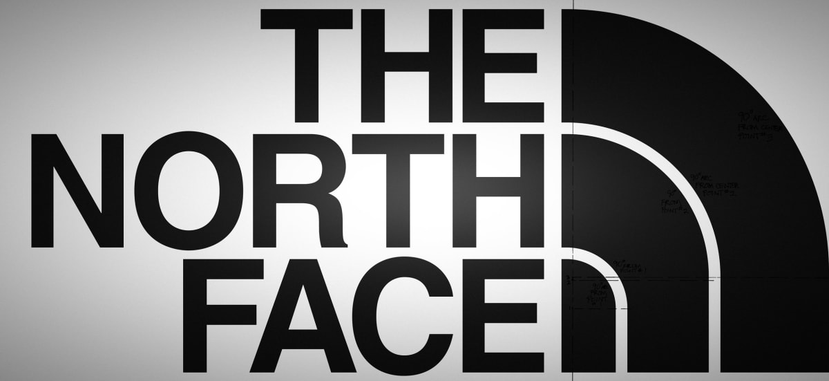 Hand-painted North Face logo wall in an Alameda workspace
