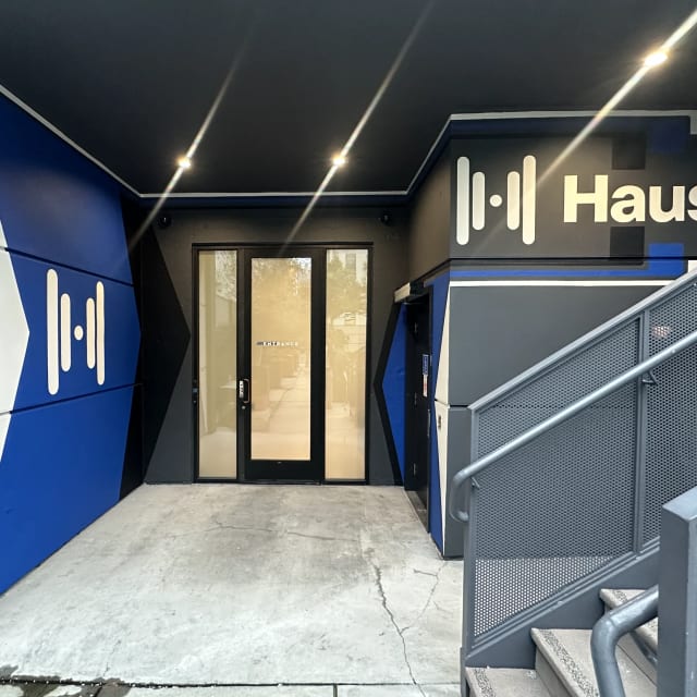Haus logos and directional branding in an office entrance in the Sacramento area
