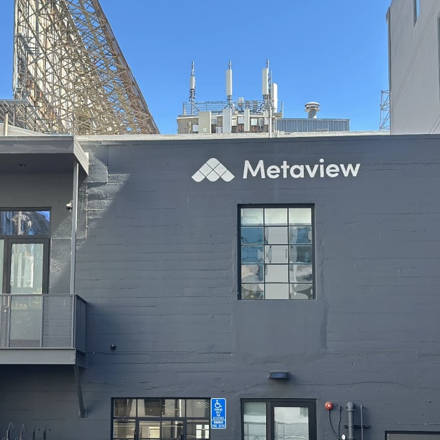 Completed white Metaview logo above windows on a dark building in the Sacramento area