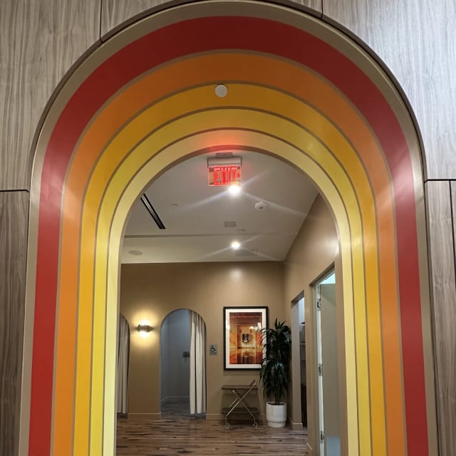 Close-up of orange and yellow stripes around an arched doorway