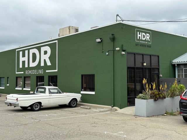 HDR Remodeling lettering on a green building and entrance
