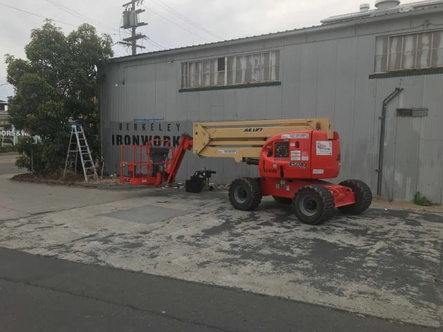 Boom lift and ladders outside the Berkeley Ironworks building in Sacramento
