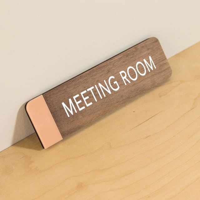 Wooden Meeting Room sign with a peach accent strip for a Sacramento office