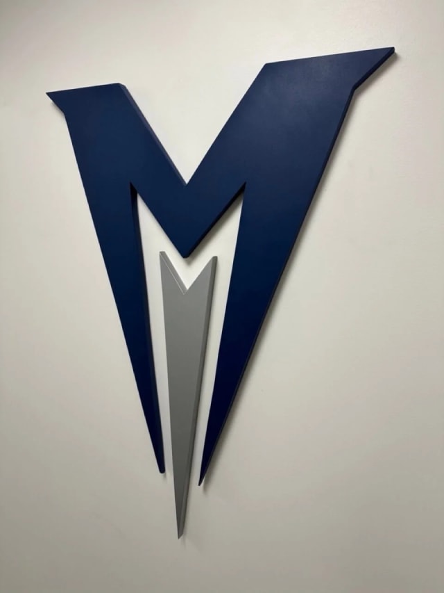 Close-up of Menlo College’s blue dimensional M logo