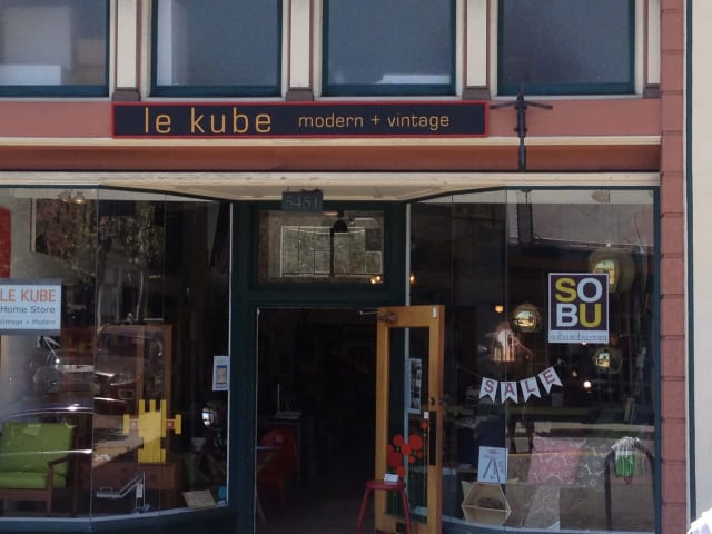Le Kube modern and vintage shop lettering above a storefront