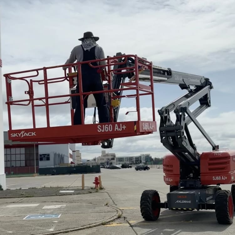 Boom Lift Sign Installation Skyjack Crew.