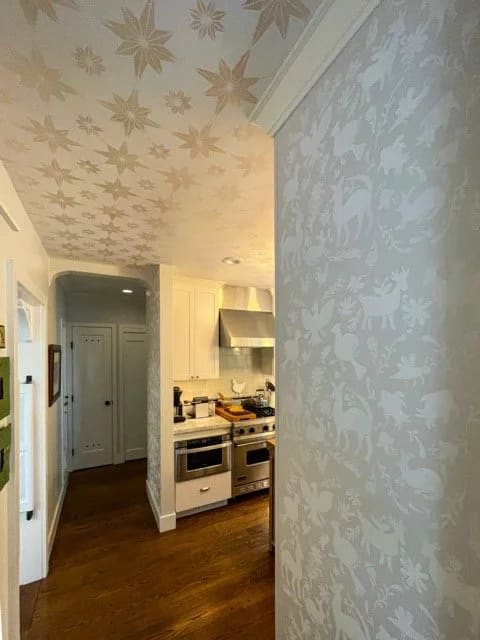Corner detail of a custom painted kitchen stencil
