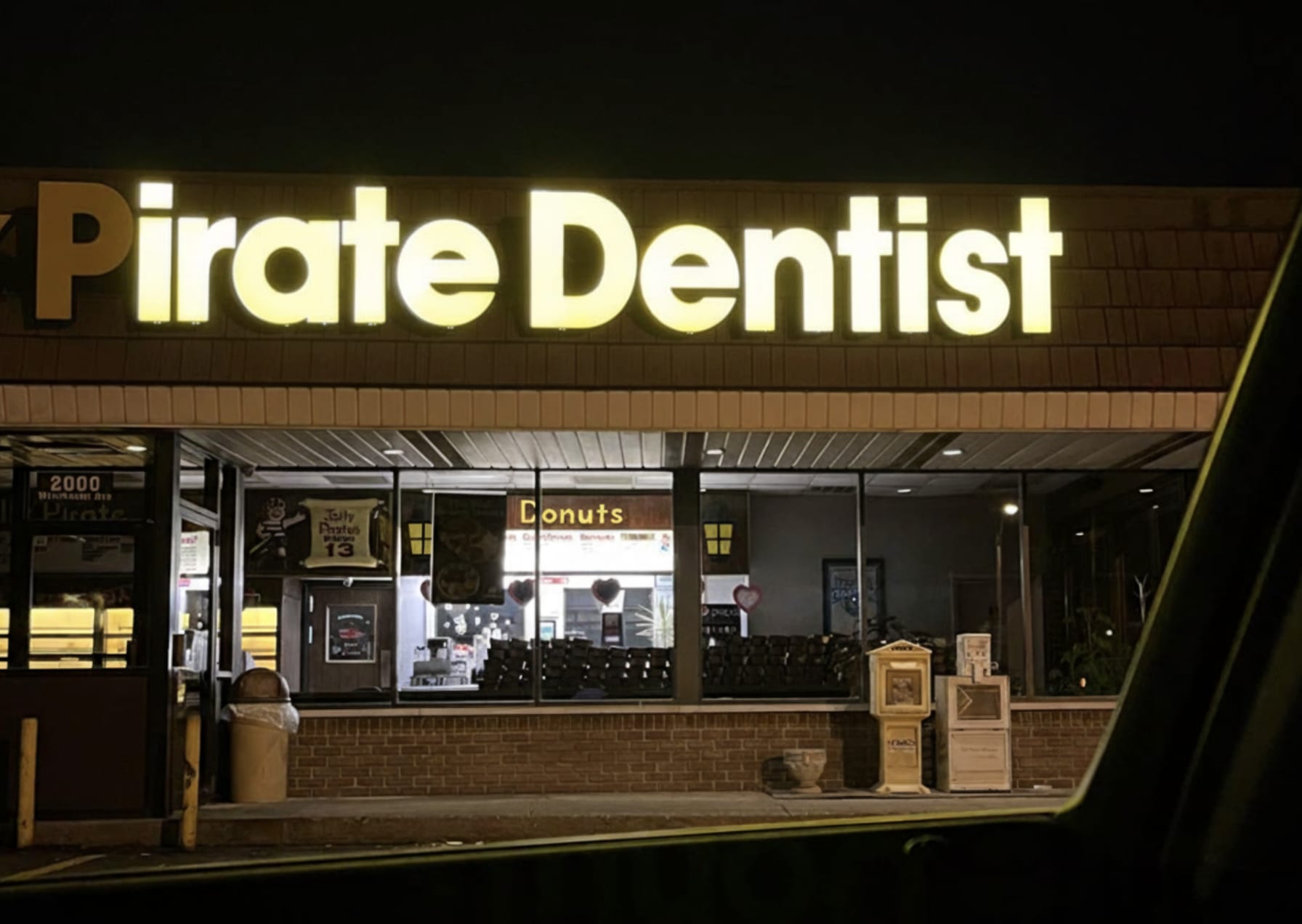 Irate Dentistry sign with burned out P letter—an example of what happens when sign projects go wrong
