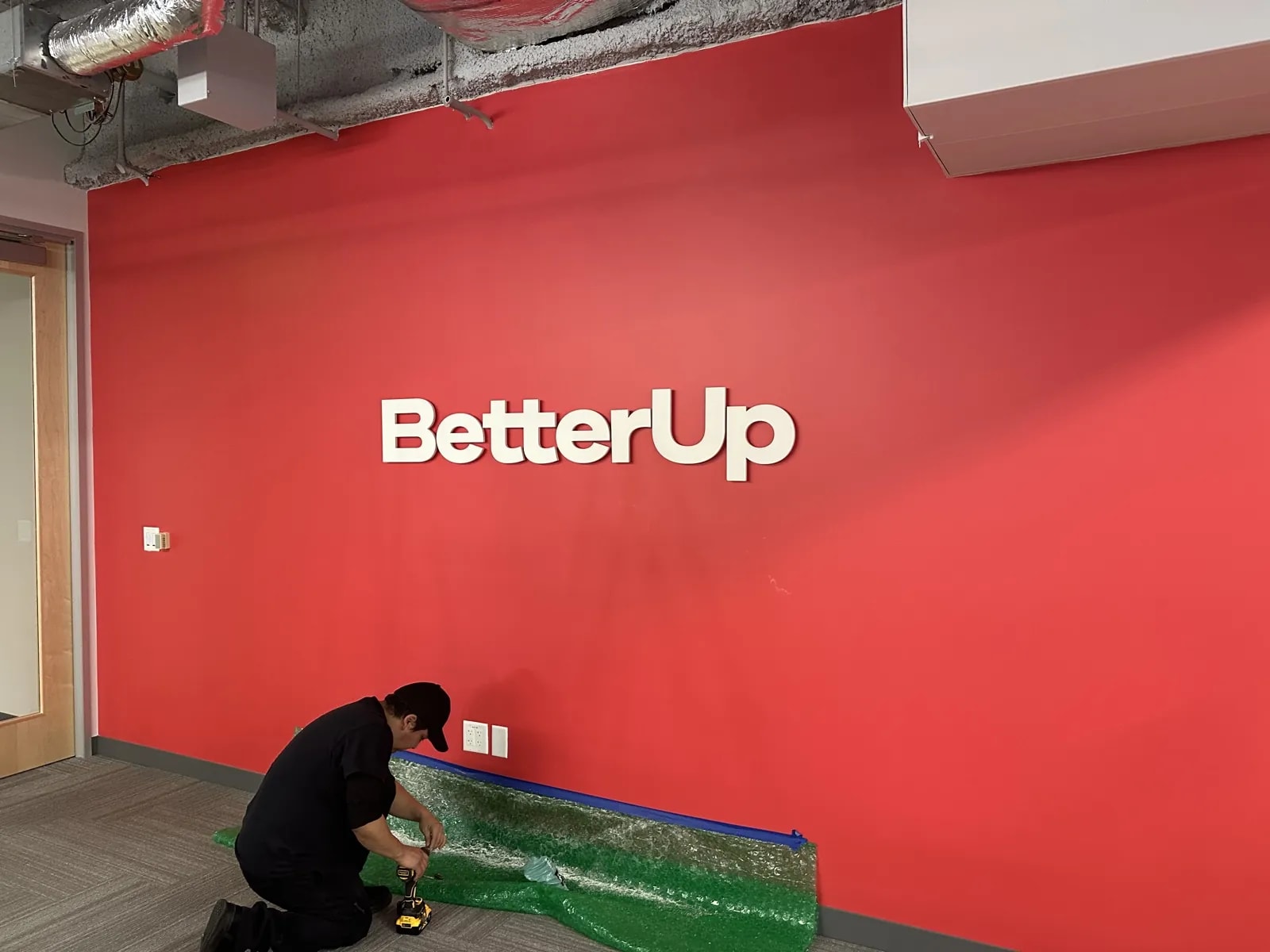 Production table with dimensional letters laid out for installation