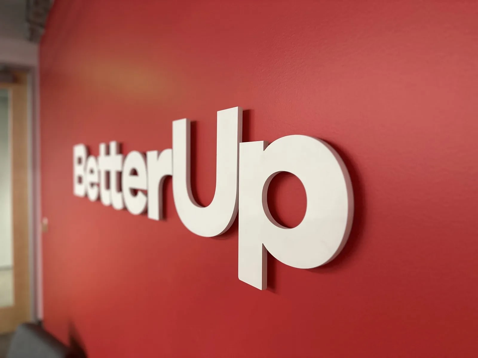 Finished BetterUp lobby sign installation wide shot