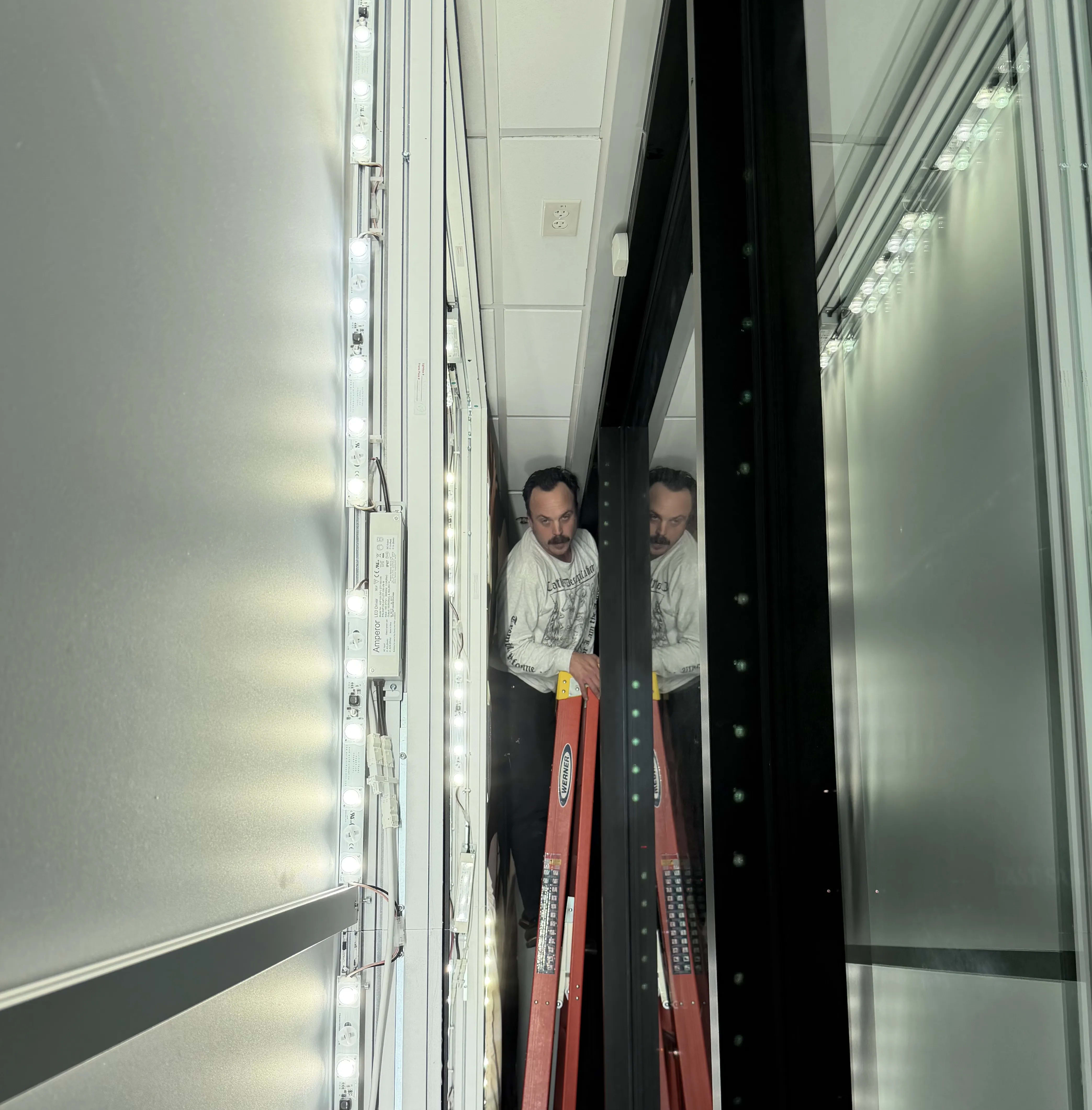 Wall frame installation for a silicone edge graphics display