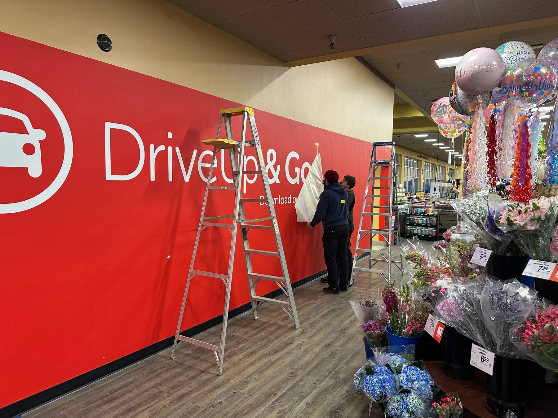 Safeway vinyl wall graphic installation in progress