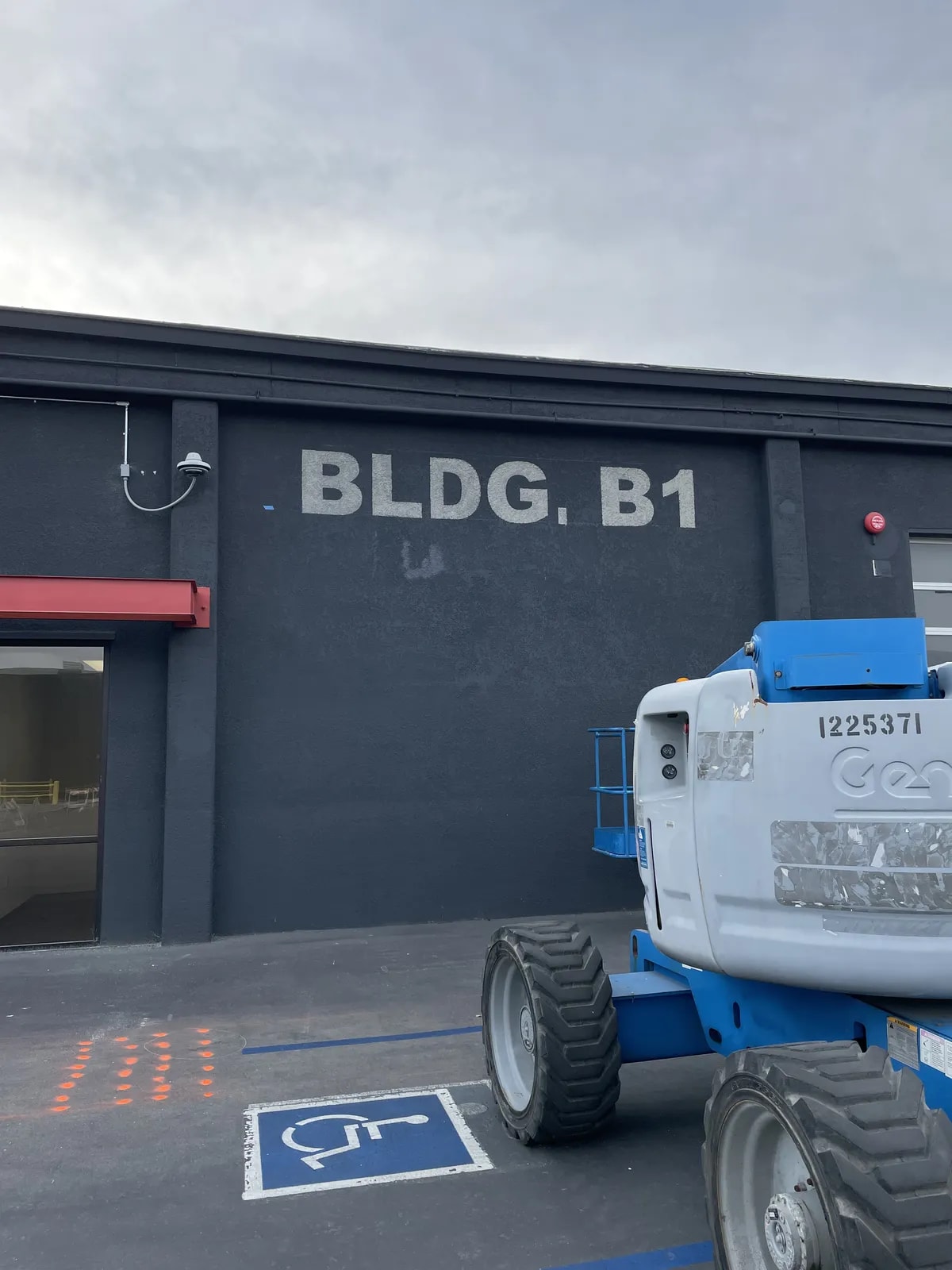 Artist painting a lobby mural for a Bay Area business