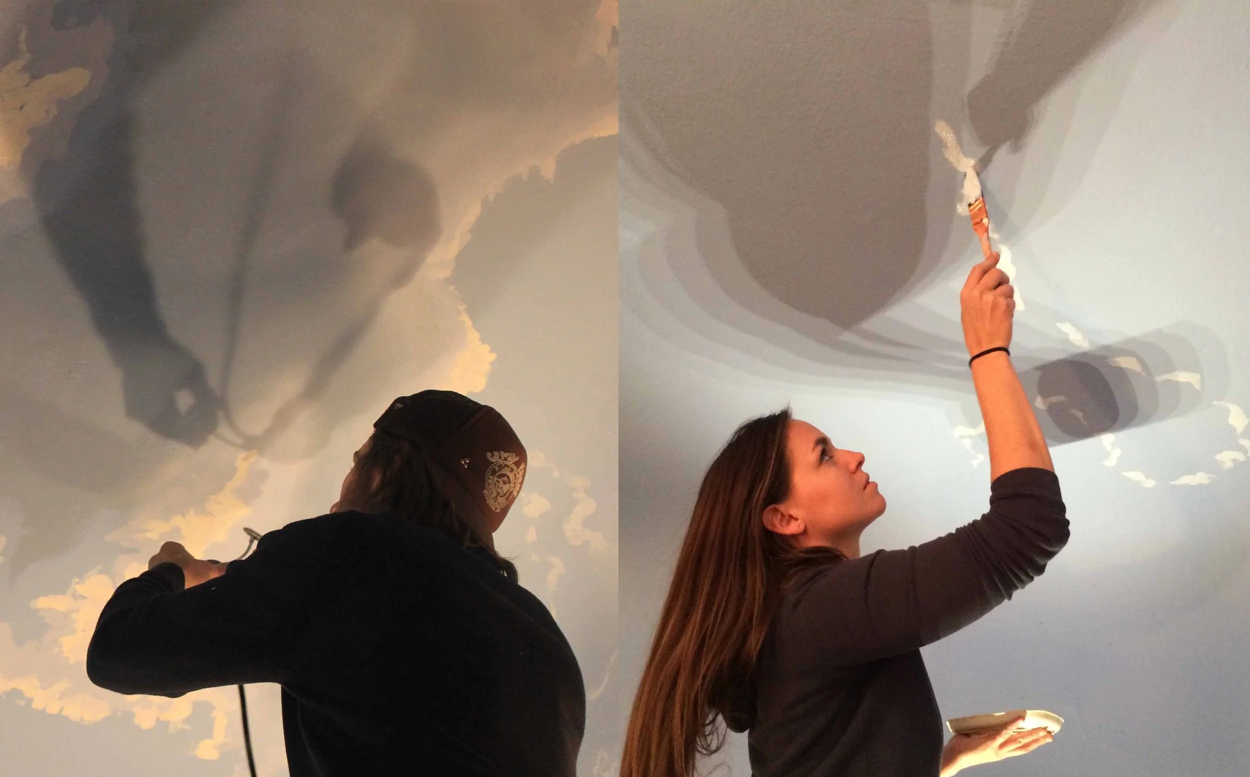 Mural artists painting a sky mural