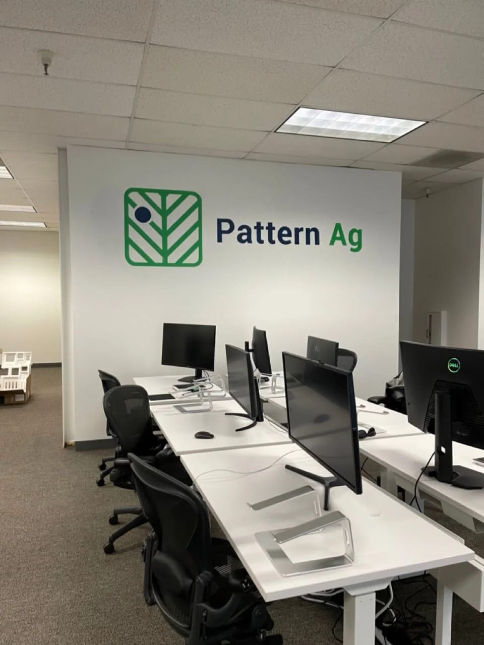 Hand-painted Pattern Ag office logo in a Silicon Valley workspace