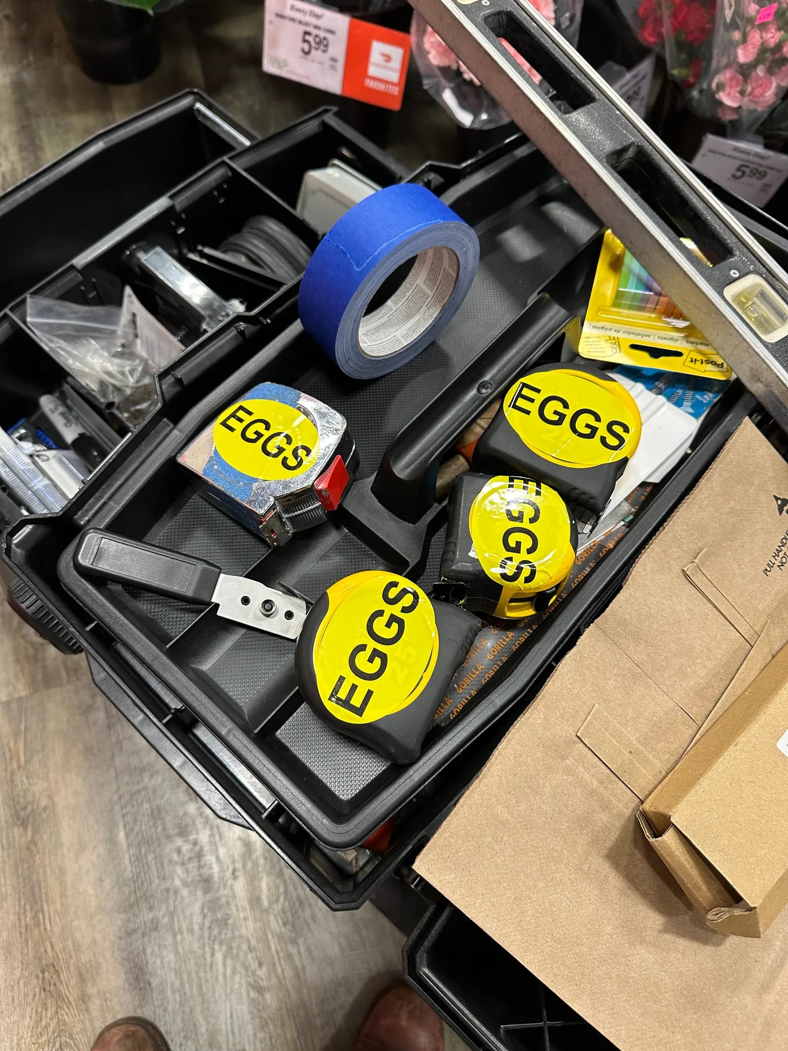 Close-up of vinyl installation tools and EGGS stickers