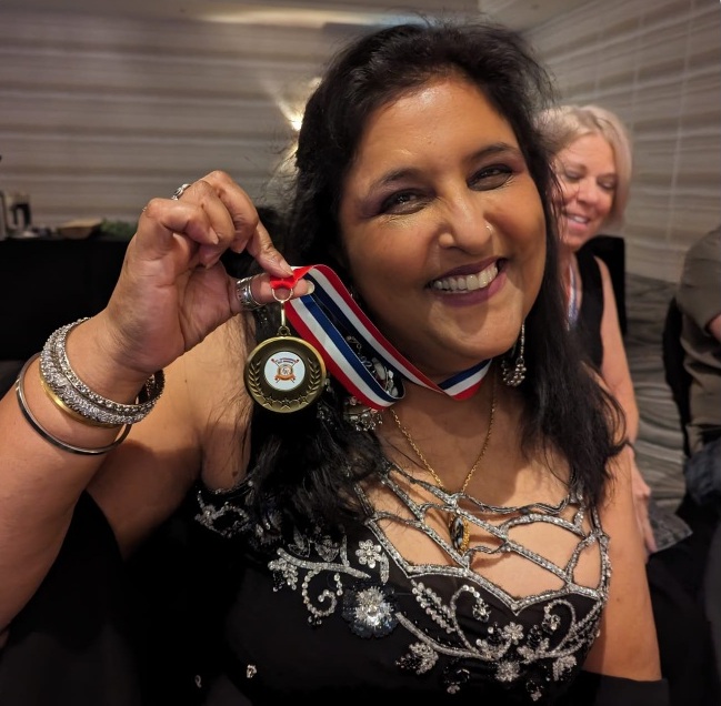Bhupi with rowing medal