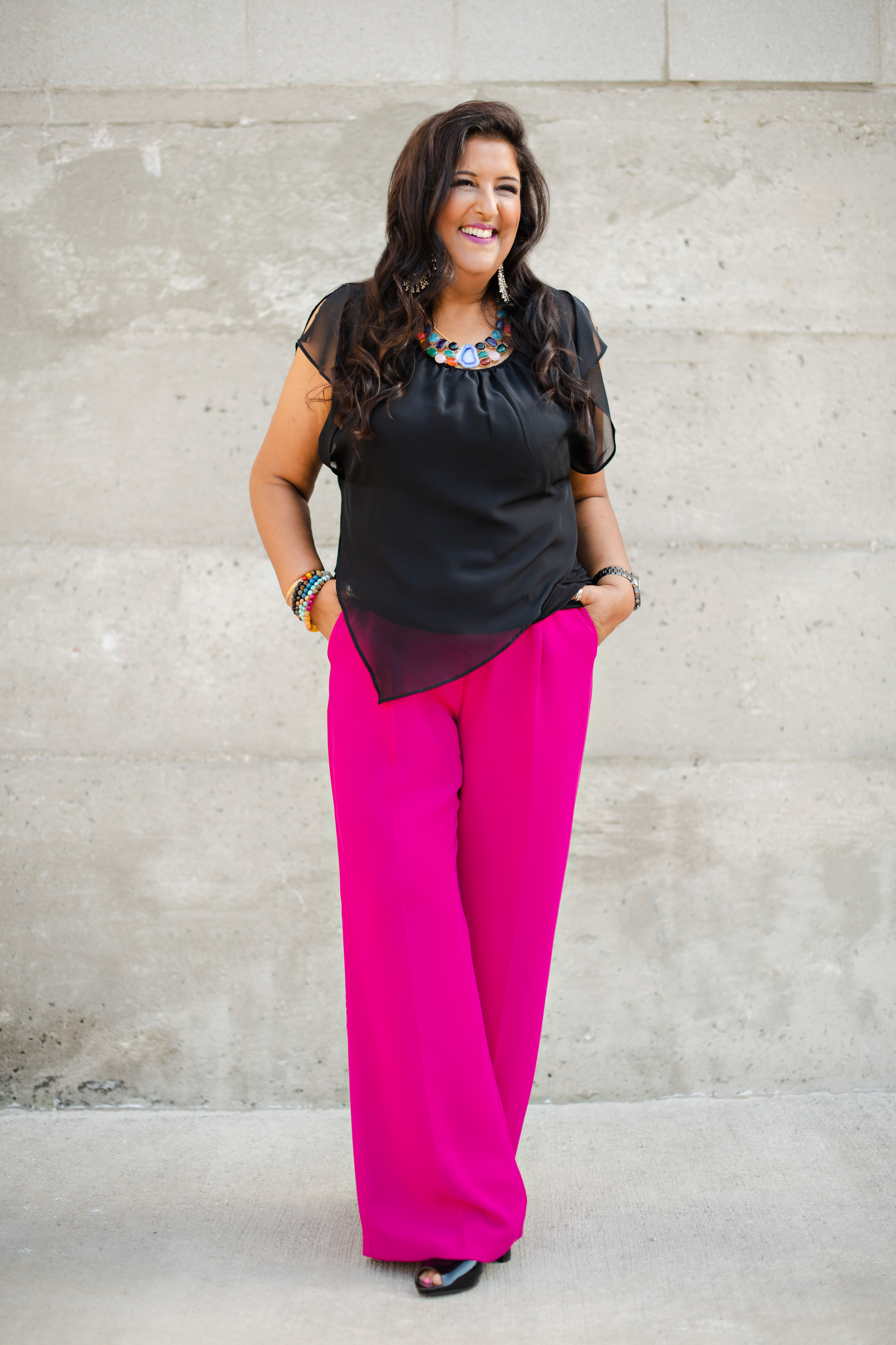 Bhupi Panesar smiling in pink trousers