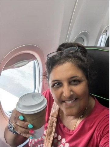 Bhupi Panesar on a plane with coffee