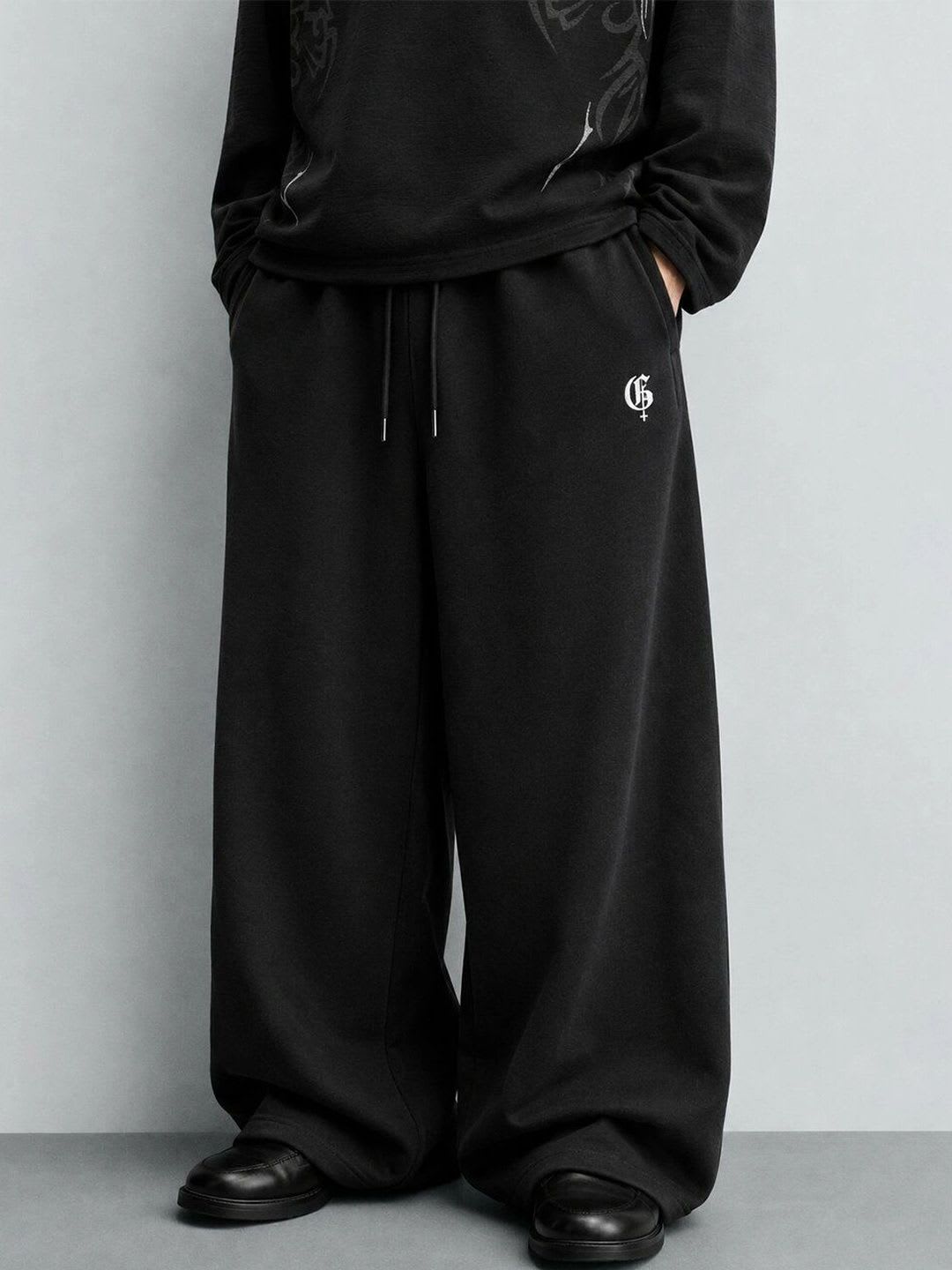 GENRAGE Men Graphic Baggy Track Pants - default view