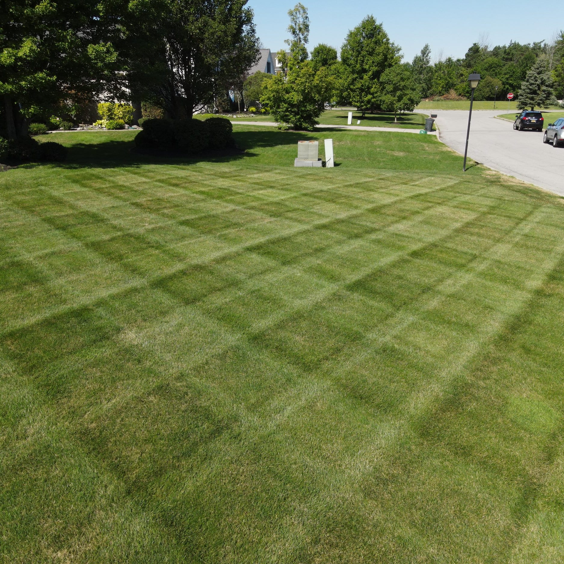 A beautiful cross pattern on a freshly mowed lawn, showcasing the artistry of lawn care