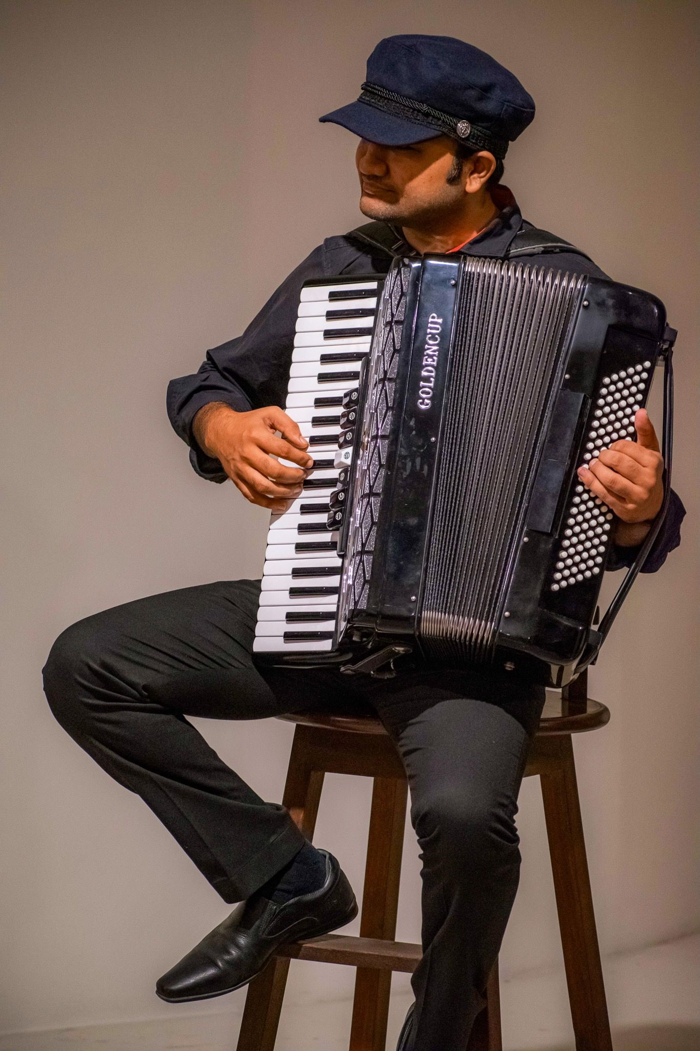 A photo of Diptangshu playing accordion