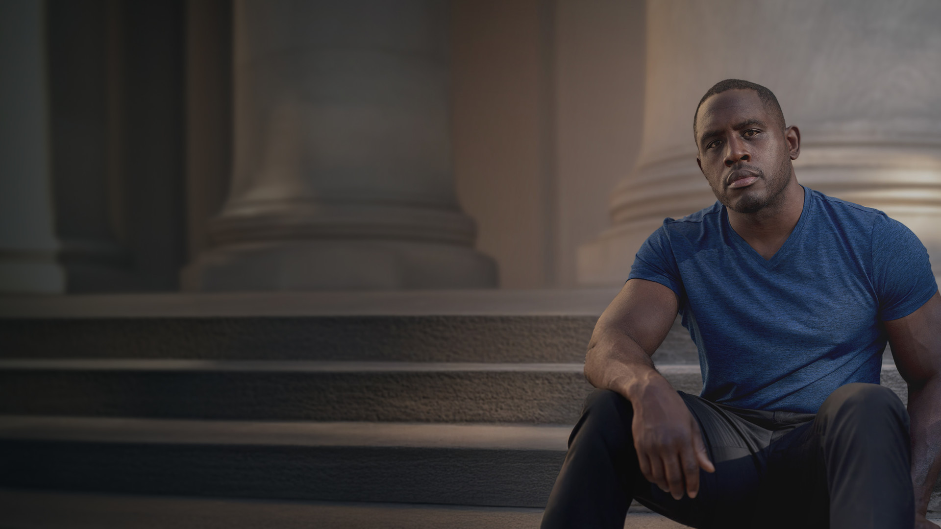 Ed Latimore sitting on stone steps
