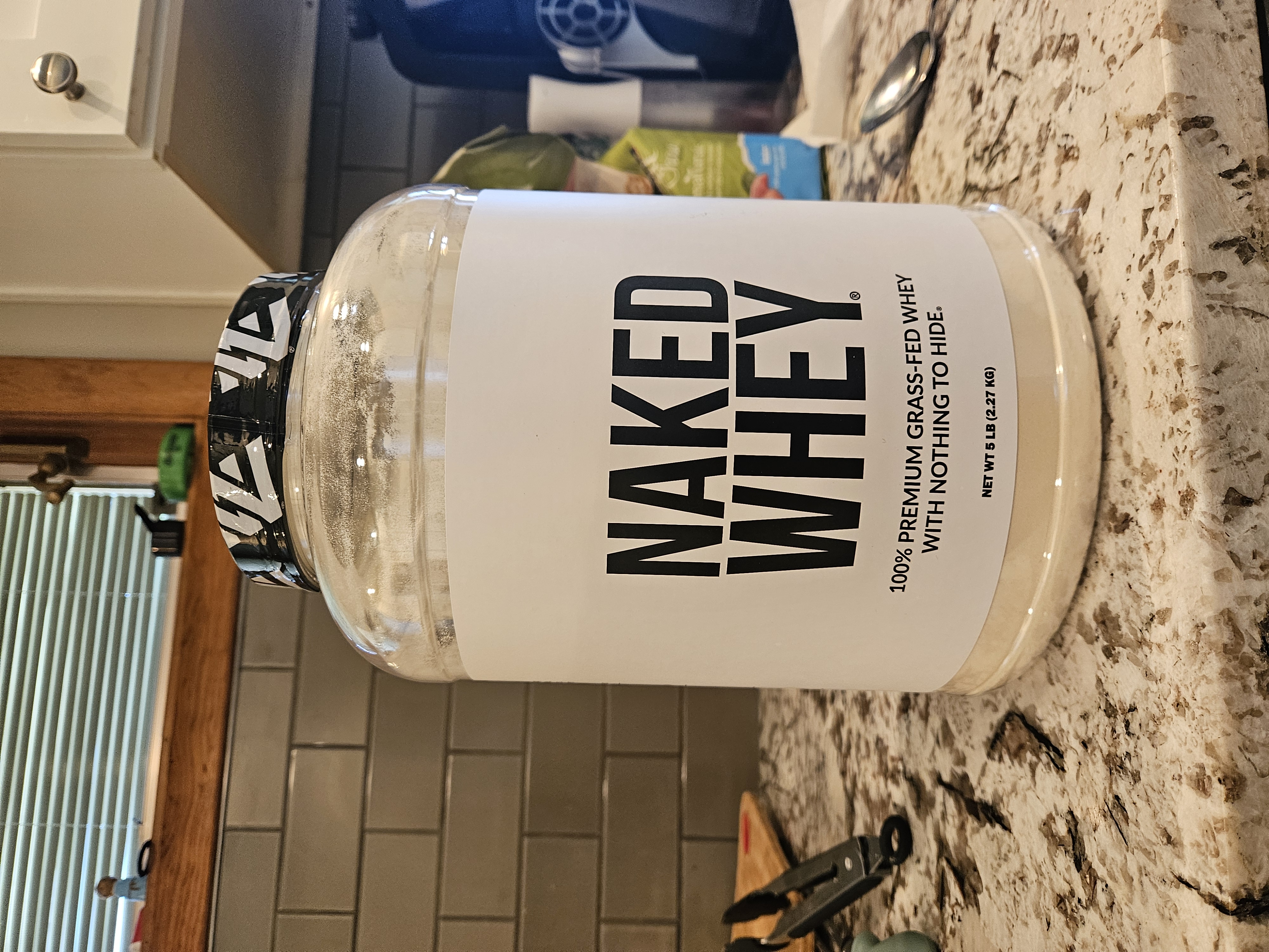 Naked Whey Protein 5lb tub front label - grass-fed unflavored whey protein review