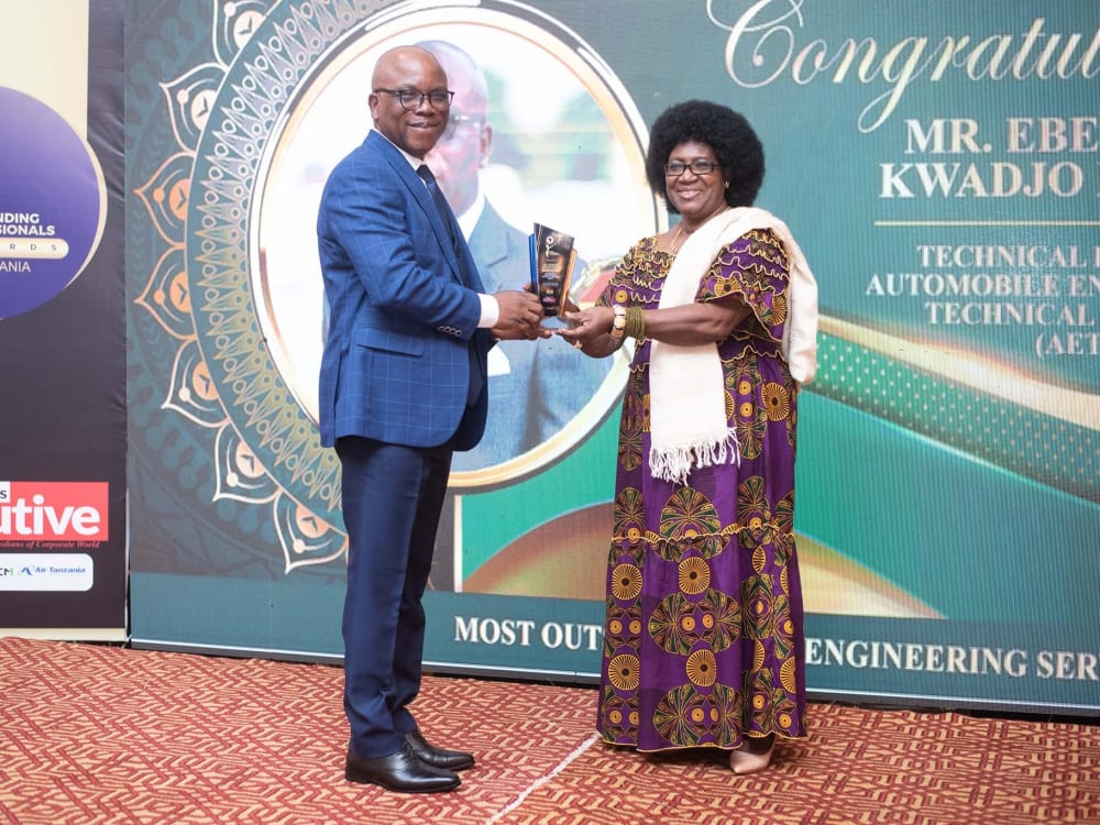 Ing. Dankyi receiving a trophy on stage at the Africa Outstanding Professionals Awards in Tanzania