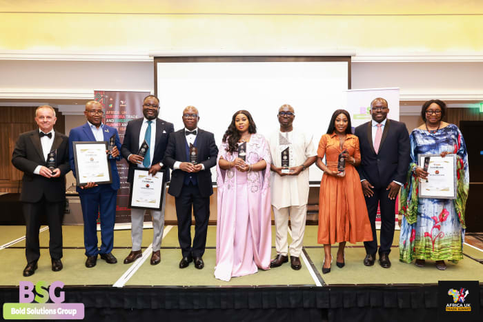 Group of award honourees on stage in London