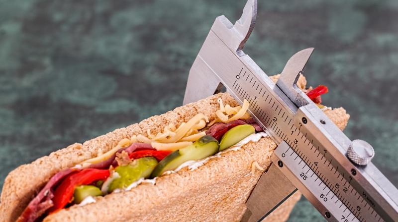 Image of food with visible calorie counts, representing how nutritional labels influence brain responses to food, based on research findings.