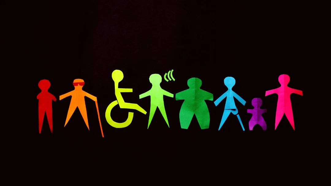 Colorful paper cutouts representing people of all body types and abilities, highlighting diversity and inclusion.