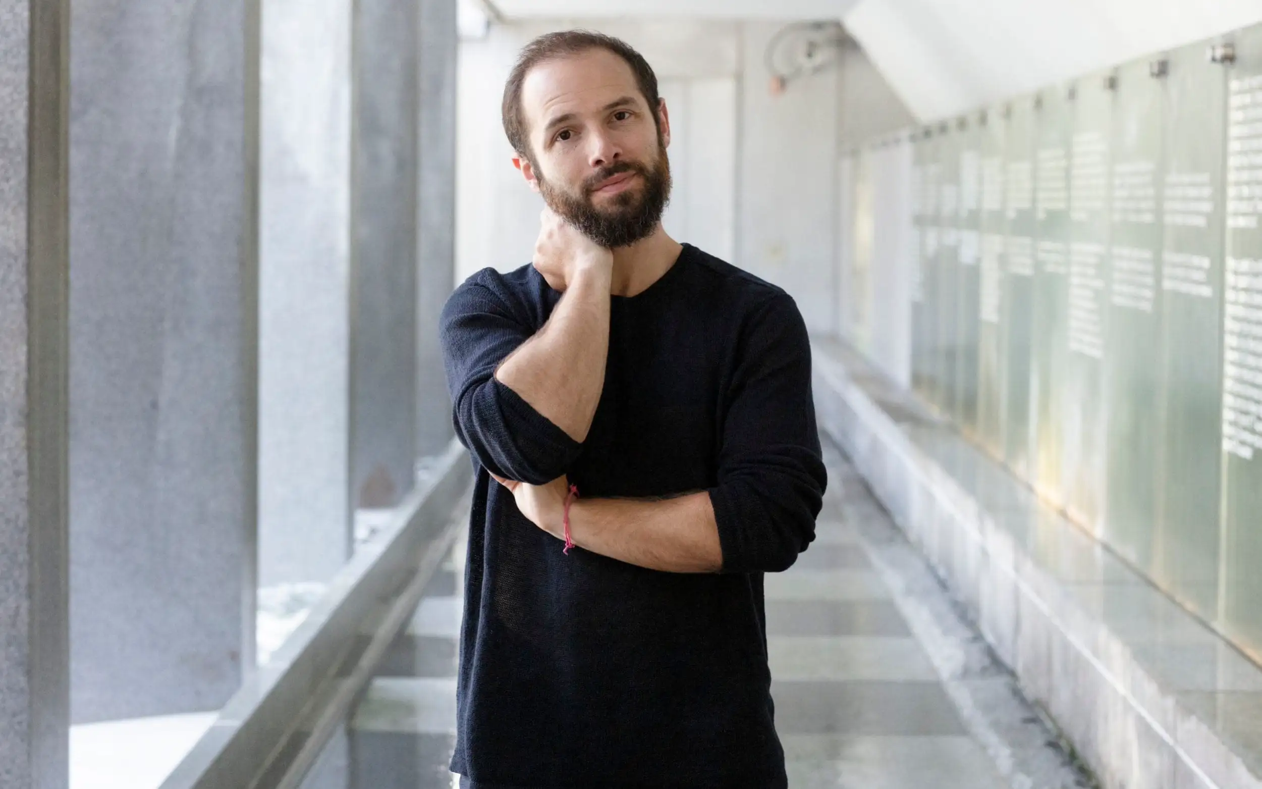 Portrait of Aza Raskin, the designer who created the infinite scroll feature, used in discussions about attention design and social media impact.