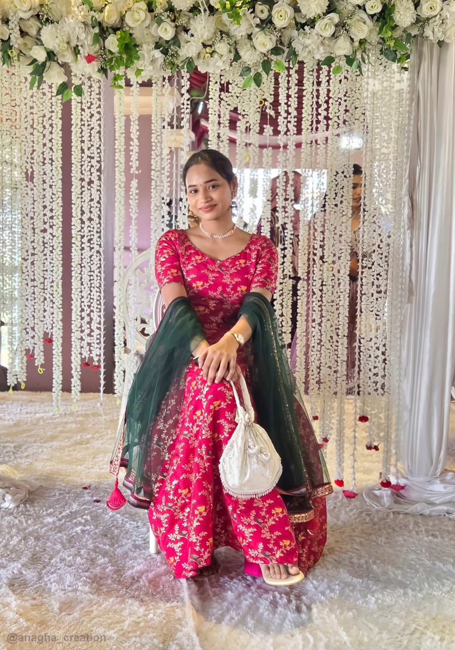 Bride in a red custom bridal ghagra designed by Anagha Creation, Kolhapur