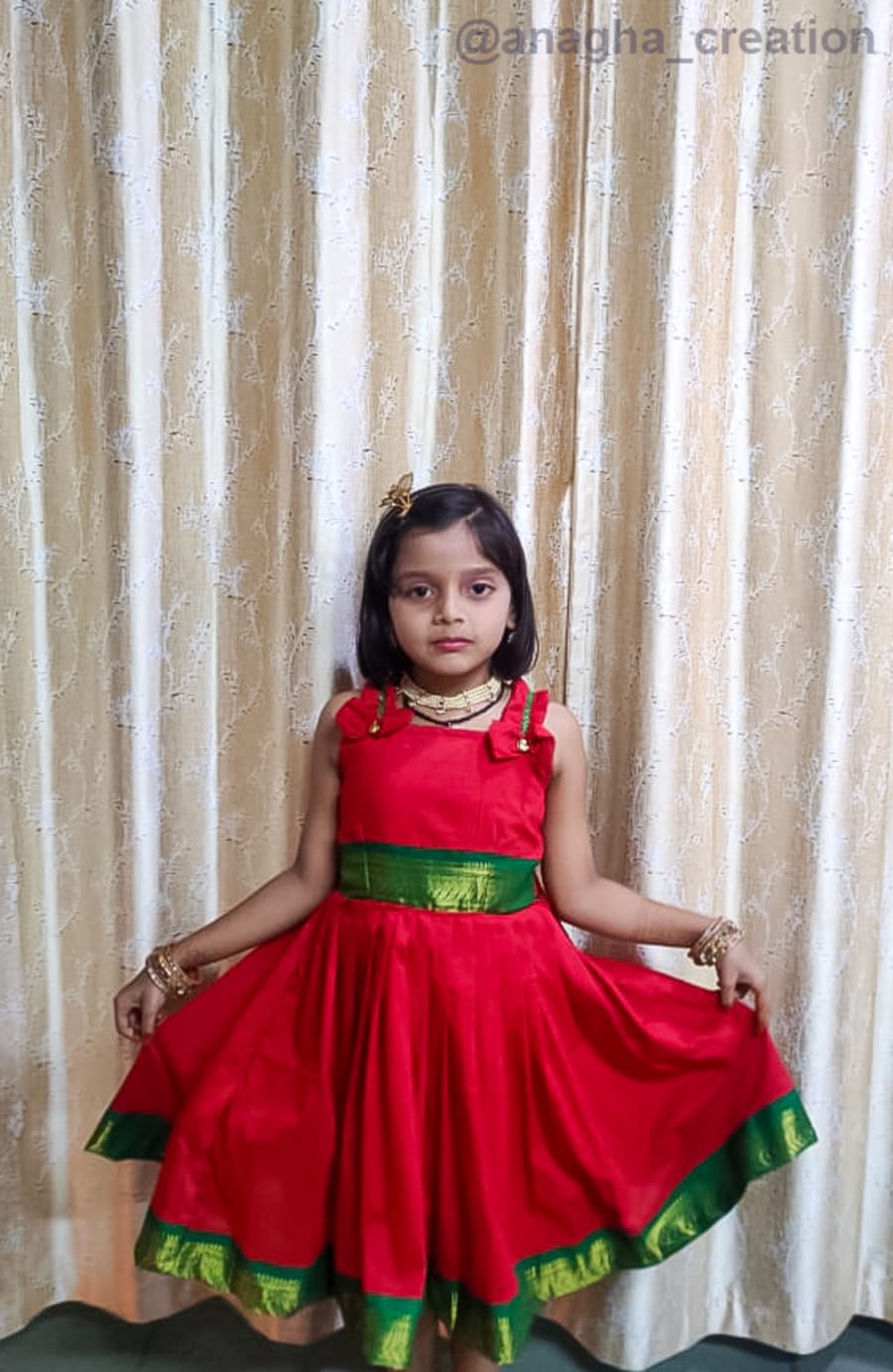 Child in red ethnic wear designed by Anagha Creation, Kolhapur