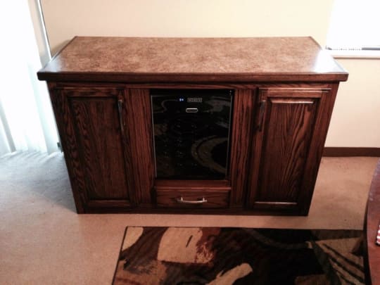 Finished wooden bar cabinet and countertop.