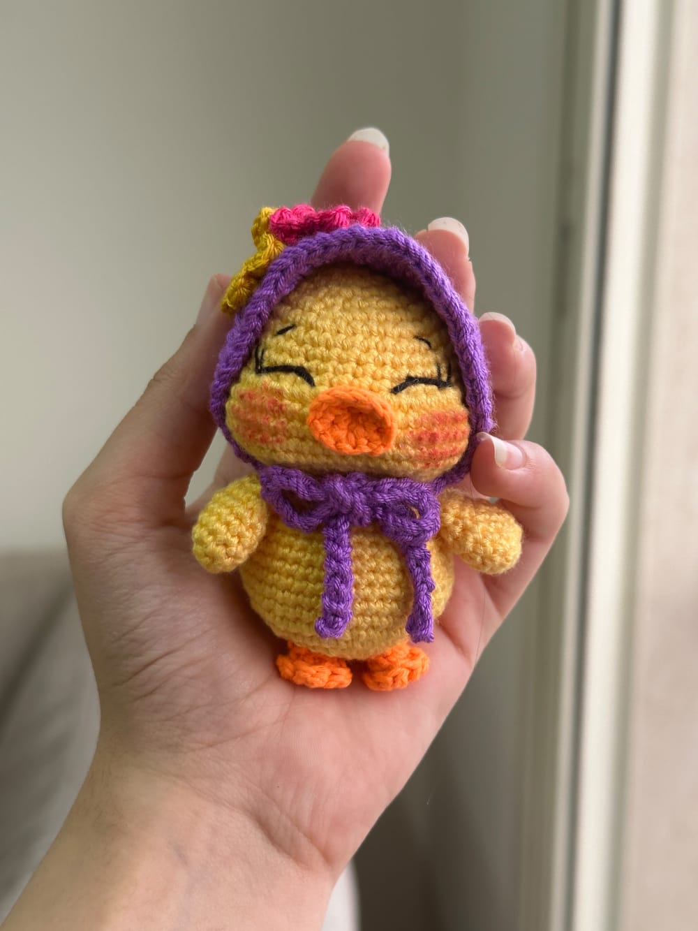 Duck charm with purple hat