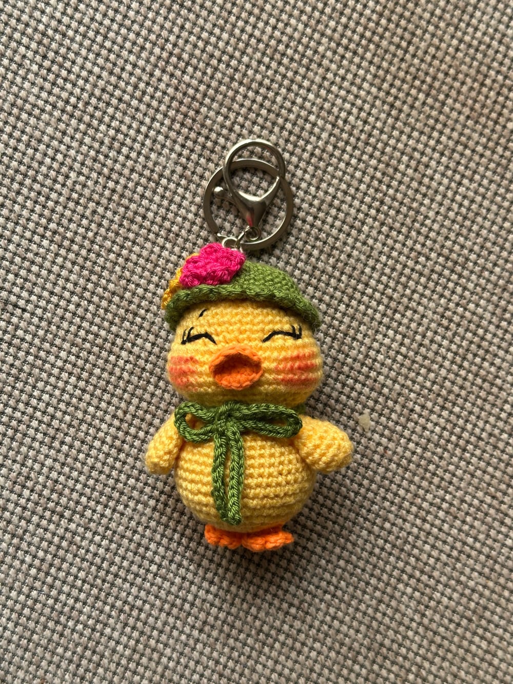 Duck charm with olive hat