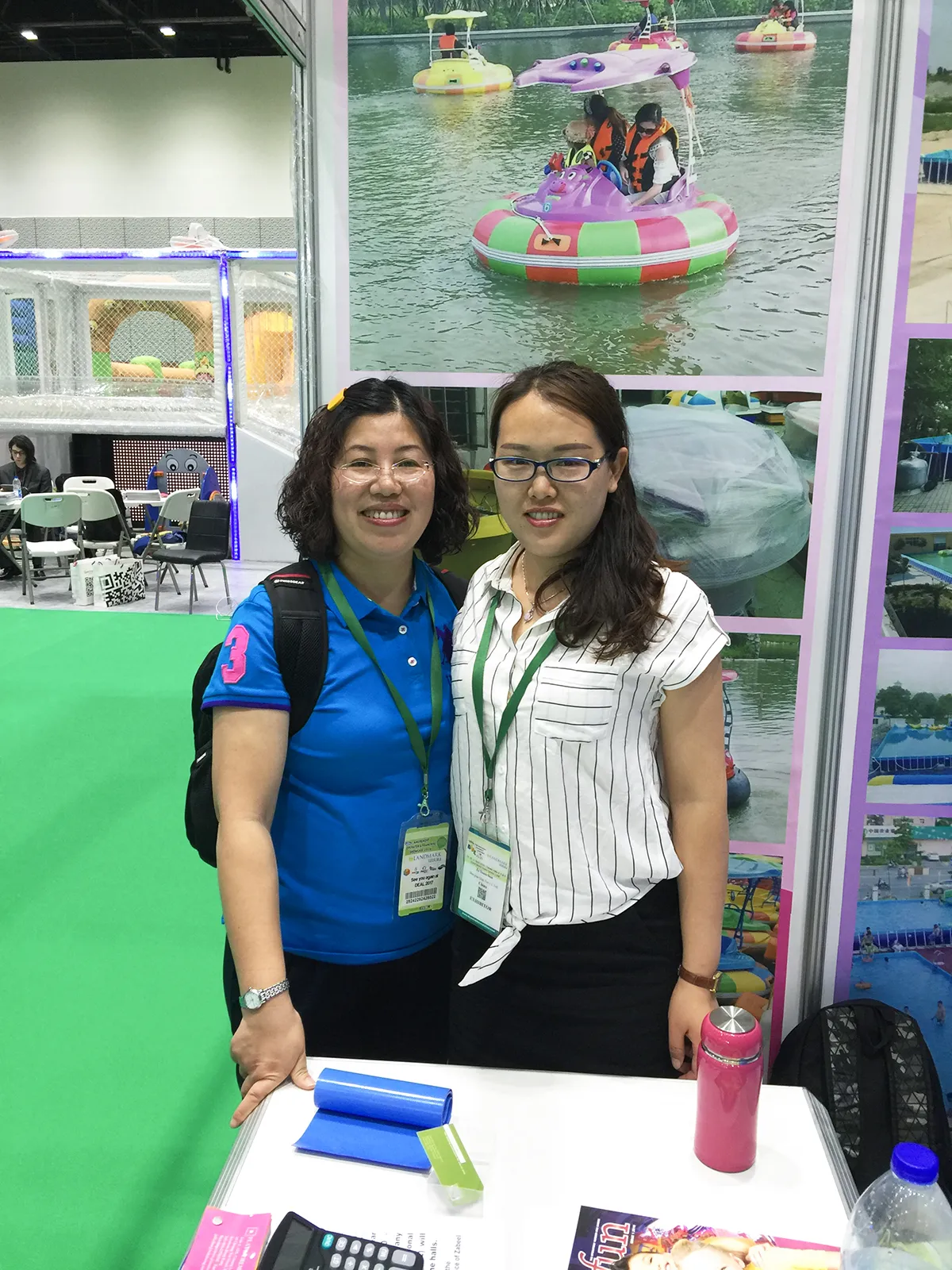 Shanghai Qiqu Fun Founder Emily at IAAPA Dubai 2016, marking our strategic pivot from fragile fiberglass to indestructible armored HDPE commercial bumper boats